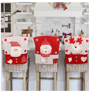 Detail of Christmas chair covers featuring Santa, Snowman and Reindeer embroidery