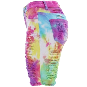 Detail view of colorful tie-dye denim shorts featuring stylish distressed frayed holes
