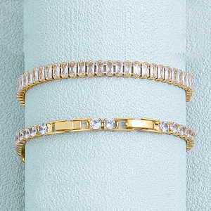 Detail of 18K gold stainless steel tennis bracelet with square and round cubic zirconia
