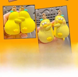 Detail of yellow cartoon pear charms with built-in magnets for interactive bonding