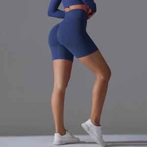 Detailed side view of high-waisted peach lift yoga shorts in royal blue seamless fabric