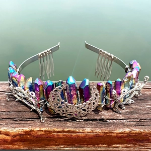 Close-up of rainbow crystal crown with silver hollow moon and branch details on hair comb
