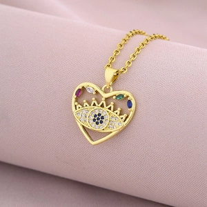 Detailed close-up of heart-shaped evil eye pendant with multicolored zircons on gold chain
