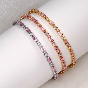 Three-piece set of elegant tennis bracelets with pink cubic zirconia in gold and silver
