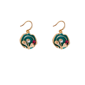 Vintage gold plated enamel flower earrings with pearls and crystals on white background