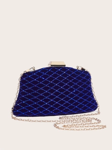 Detailed macro view of navy blue evening clutch with shimmering diamond lattice pattern