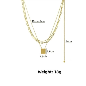 Detail of gold layered stainless steel necklace with L-letter pendant and sizing info