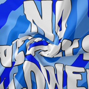 Close-up of blue camouflage tapestry fabric with NO POWER bold letter printing