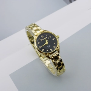Elegant gold quartz watch with a black numeric dial and slim metal strap at a 45-degree angle