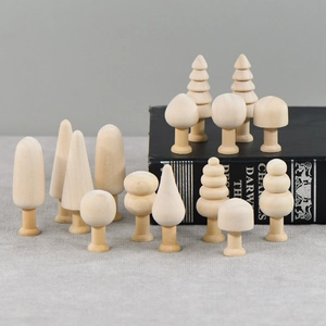 DIY unfinished wooden mushroom and tree set for painting crafts on grey linen surface
