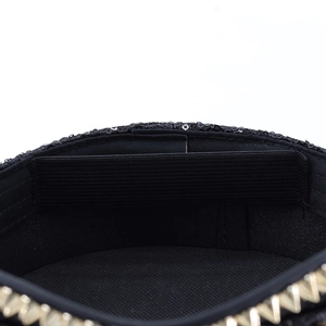 Detail of silver sequin captain hat featuring gold studs and internal elastic band strap