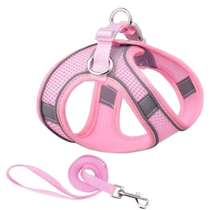 Pink breathable mesh dog harness and leash set with reflective strips on white background