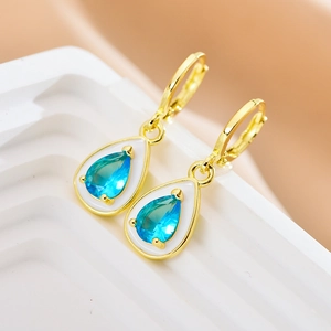 Water-drop hoop earrings with blue gemstone and white enamel border in gold finish