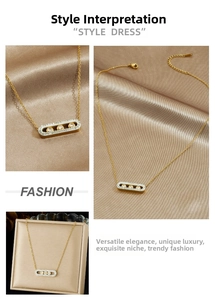 Macro detail of gold-plated stainless steel necklace with three sliding diamond pendants