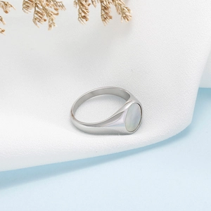 Close-up of minimalist silver stainless steel ring with elegant oval shell inlay