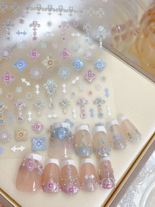 Detailed view of iridescent laser shell nail art stickers with vintage pattern design