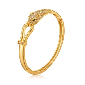 Luxurious gold-plated leopard head bangle with white zircons and green gemstone eyes
