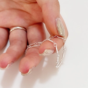 Minimalist S925 sterling silver twisted chain bracelet for women on white background
