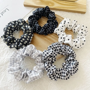 5-piece set of floral, polka dot and plaid scrunchies for women's hair styling