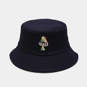 Detailed close-up of colorful mushroom embroidery on a dark blue cotton bucket hat