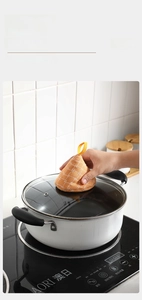 Close-up of an orange checkered cone pot lid holder with a top yellow hanging loop
