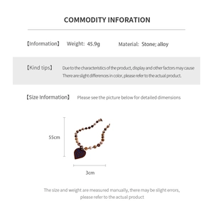 Detail view of ethnic beaded necklace with heart pendant weighing 45.9g and 55cm length