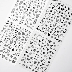 Set of 4 black and white heart nail art stickers featuring Love and You & Me text