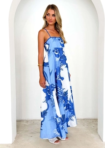 Detail of blue and white floral summer maxi dress with spaghetti straps and high waist