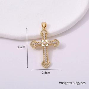 Golden cross pendant with clear stones and pearl detail showing 3.6cm by 2.5cm dimensions
