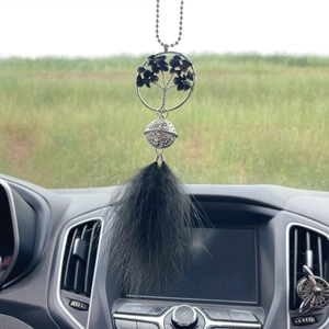 Car mirror ornament featuring a black crystal tree of life with elegant feathers