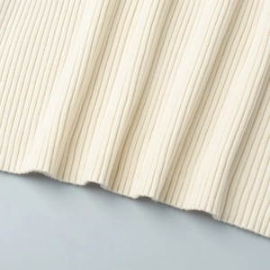 Detailed macro view of the premium cream ribbed knit fabric with soft texture