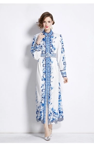 Detail of vintage blue floral print dress with stand collar and belted waist design