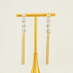 Elegant gold tassel earrings featuring square-cut zircon stones and layered metal fringes