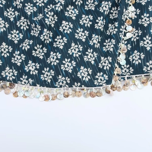 Navy blue floral printed skirt pants featuring colorful shell beads and white tassel trim