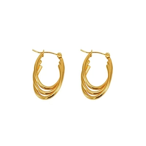 Close-up of golden multi-layered oval hoop earrings with polished finish on white background
