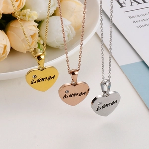 Engraved heart pendant necklace in gold, rose gold, and silver with a small crystal
