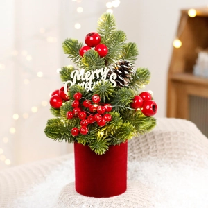 Mini LED Christmas tree in red velvet pot with pine cones and red berries decoration