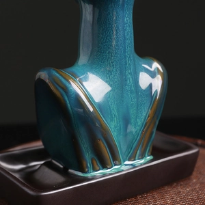 Artistic ceramic backflow incense burner featuring a blue-green glazed lady figurine