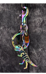 Macro shot of metallic dinosaur skeleton keychain with colorful rainbow gradient finish