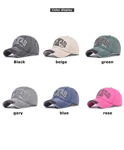 Macro shot of Texas embroidery on washed cotton baseball caps in six diverse colors