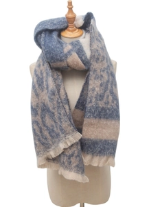Detail of blue and beige leopard jacquard scarf with soft fringe on a mannequin