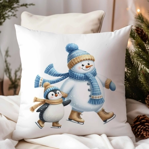 Gros plan sur la housse de coussin de Noël avec bonhomme de neige et pingouin qui patinent