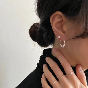 Minimalist 925 sterling silver pearl stud earrings and rings set worn by a model