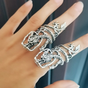 Close-up of vintage silver dragon rings for men with adjustable open band design