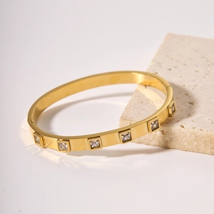 18k gold plated stainless steel bracelet featuring square zircon stones on white background