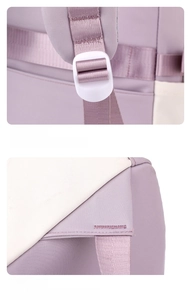 Detail of adjustable strap buckle and reinforced stitching on a purple school backpack