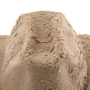 Macro view of plush brown faux rabbit fur texture on a vintage British style fedora hat