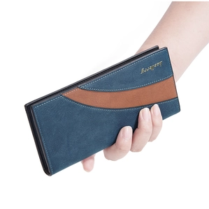 Detailed close-up of a blue and brown suede long wallet for men with a metallic logo