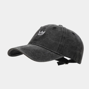 Detail shot of white crown embroidery on vintage washed dark grey cotton baseball cap