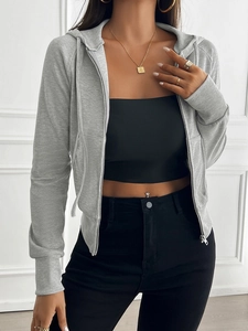 Close-up of gray ribbed zip-up hoodie featuring a cropped fit and slim silhouette